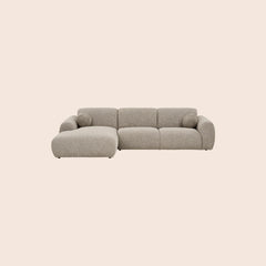 Grå modulsofa med chaiselong og lavt ryglæn - moderne komfort til stuen.